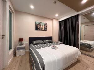 En eller flere senge i et værelse på Seven Seas Resort Jomtien Pattaya + 25 billeder