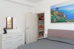Postel nebo postele na pokoji v ubytování Tao Naxos Suite