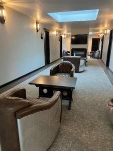 a living room with couches and a table in a room at Palooza Basecamp in Cascade