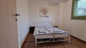 Posteľ alebo postele v izbe v ubytovaní Apartman Lena