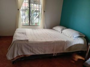 Letto o letti in una camera di Guaxique