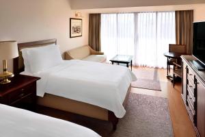 Postel nebo postele na pokoji v ubytování Marriott Mena House, Cairo