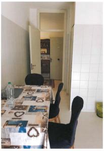 a dining room with a table and chairs at Baraka Guest House Venice in Mestre