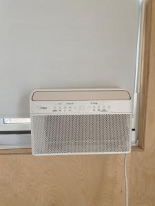 a air conditioner sitting on the floor in a room at Rivers Edge Retreat in Clearwater