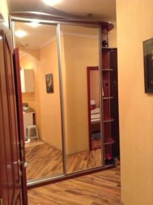 a sliding glass door in a room with a wooden floor at Apartment 2 rooms Lux near Inturist Prospect Soborniy in Zaporozhye