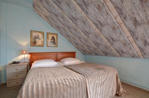 Postel nebo postele na pokoji v ubytování Hotel Dworek nad Regą