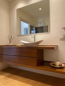 a bathroom with a sink and a mirror at Le Stanze di Federico apartment e Costanza Luxury apartment in Palermo +46 photos