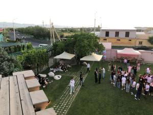 an overhead view of a crowd of people on the grass at Otyak Hotel EVN Zvartnots Airport in Pʼarakʼar