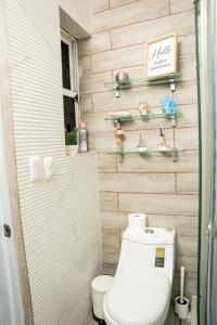 a bathroom with a toilet and a wooden wall at Habitación privada en Puerto Plata Bayardo in San Felipe de Puerto Plata +21 photos