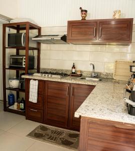 a kitchen with a sink and a counter top at Habitación privada en Puerto Plata Bayardo in San Felipe de Puerto Plata