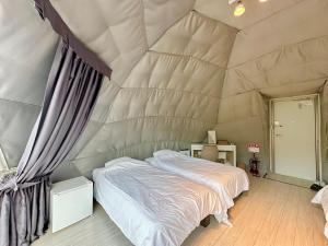 Ein Bett oder Betten in einem Zimmer der Unterkunft SORANIWA glamping