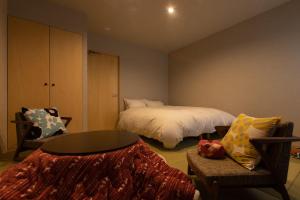 Letto o letti in una camera di 越中井波町屋旅館古香里庵