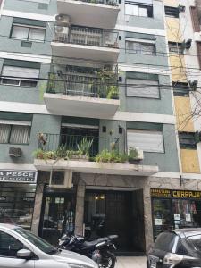 a building with a motorcycle parked in front of it at Oh Barrancas in Buenos Aires