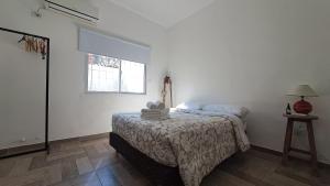 Postel nebo postele na pokoji v ubytování Hornera Canning - A metros de Metropolitano