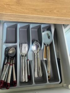 a drawer filled with utensils and spoons at Calm Home in Kuala Terengganu in Kuala Terengganu
