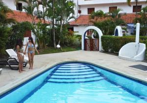 Bazén v ubytování Hermosa casa frente a la playa nebo v jeho okolí