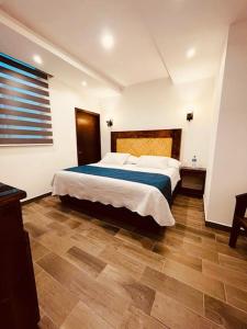 Postel nebo postele na pokoji v ubytování Gran Hotel Yacatas