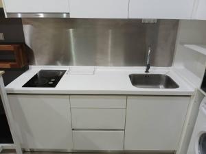 a kitchen with a sink and a counter top at Kuromi卡通主题浪漫公寓 配有大屏幕蓝牙音响电影房 Netflix Youtube in Johor Bahru