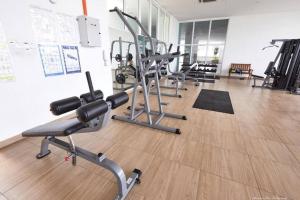 a gym with several exercise bikes in a room at Kuromi卡通主题浪漫公寓 配有大屏幕蓝牙音响电影房 Netflix Youtube in Johor Bahru