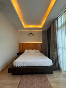 Katil atau katil-katil dalam bilik di Bergauf Apartment