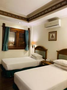 Kresna Hotel房間的床