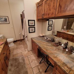 a kitchen with a large wooden counter top at Kings River Reflections in Sanger