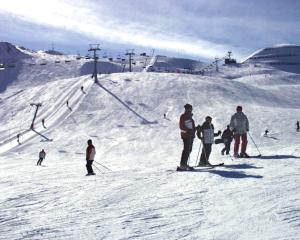 a group of people skiing on a ski slope at Apart Heim in Fügen