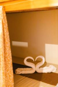 two pieces of white towels sitting on a table at katana siargao in Catagnan