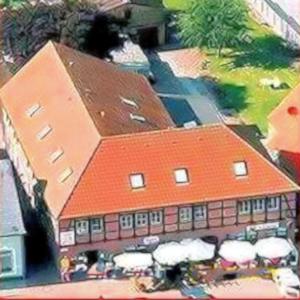 a model of a large building with an orange roof at Ferienanlage Wildt in Petersdorf auf Fehmarn