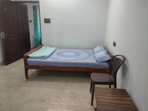Postel nebo postele na pokoji v ubytování Mansons Homestay