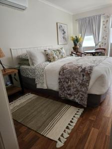 Ein Bett oder Betten in einem Zimmer der Unterkunft Ferns Miners Rest