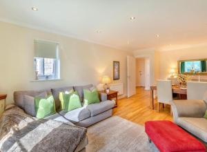 a living room with a couch and a table at Inglewood Apartment, Ingleton, Yorkshire Dales National Park, Famous Three Peaks, Near The Lake District, Pets Are Welcome in Ingleton  +25 photos