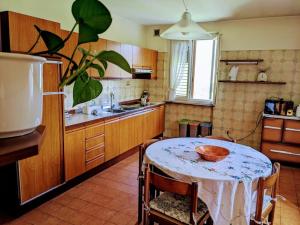 a kitchen with a table with a bowl on it at Lakeview apartment in Pergine Valsugana +20 photos