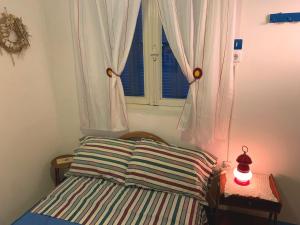 Posteľ alebo postele v izbe v ubytovaní CASA LELA 1...όπως μια φορά...like once