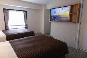 TV a/nebo společenská místnost v ubytování Belmont Hotel