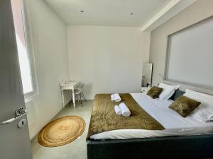Ένα ή περισσότερα κρεβάτια σε δωμάτιο στο Apartment Monaco Beach Grimaldi Forum