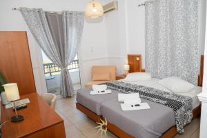 Postel nebo postele na pokoji v ubytování Galini Hotel