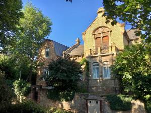 an old stone house with a turret at Villa Hartmann B&B in Bad Kreuznach