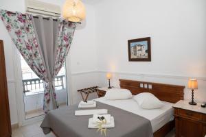 Postel nebo postele na pokoji v ubytování Galini Hotel