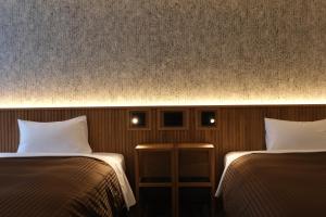 Postel nebo postele na pokoji v ubytování Belmont Hotel