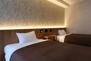 Postel nebo postele na pokoji v ubytování Belmont Hotel