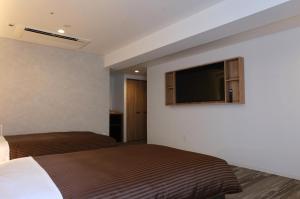 Postel nebo postele na pokoji v ubytování Belmont Hotel