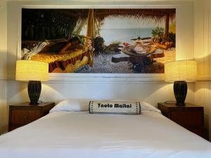 Voodi või voodid majutusasutuse Wild Ginger Hotel toas