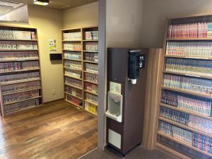 a library with a pay phone in the middle at Dormy Inn Express Koriyama in Koriyama