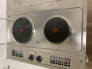 a microwave oven with two dials on it at HD Rooms in Bremen