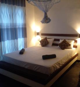 Ένα ή περισσότερα κρεβάτια σε δωμάτιο στο Hidden Garden Homestay +7 φωτογραφίες