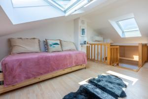 a bedroom with a bed and a skylight at Vema 1 in Selce