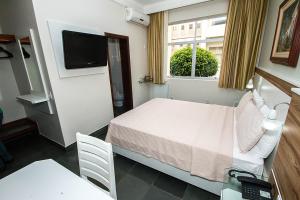 Katil atau katil-katil dalam bilik di Aipana Plaza Hotel