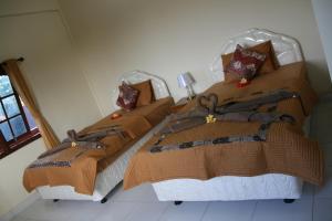 Postel nebo postele na pokoji v ubytování Santun Homestay