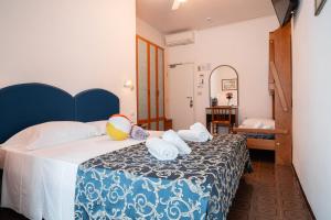 Postel nebo postele na pokoji v ubytování Blu Star Hotel